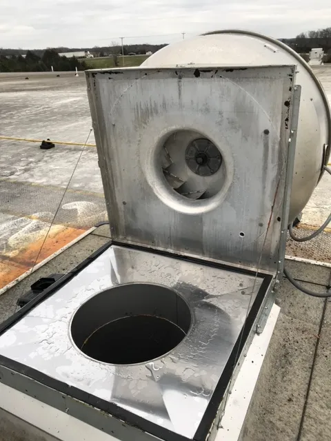 Carrollton hood cleaning technician servicing a commercial kitchen exhaust system